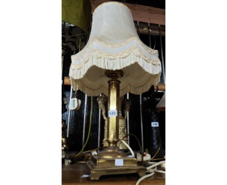 A cast brass table lamp of candlestick form with stepped pedestal base