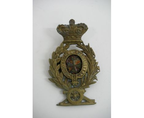 A Royal Malta Artillery helmet plate with a loose centre