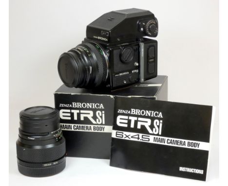 A Bronica ETRsi medium format camera, original box and manual, together with a 75mm f2.8 lens, a 150mm f3.5 lens, 220 film ba