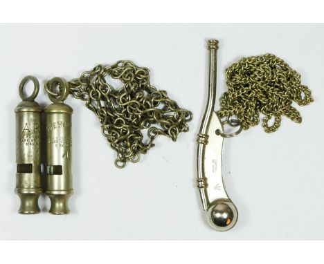 A Bosun's whistle, broad arrow, with chain, a Metropolitan whistle with broad arrow and chain and a Hudson ARP whistle 