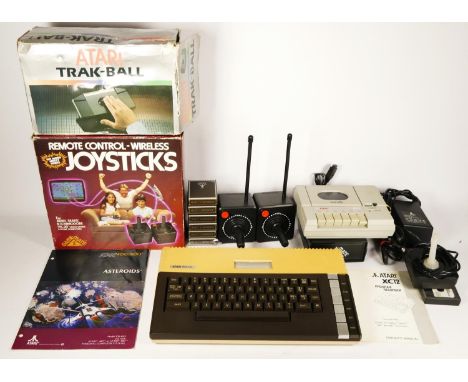 A Atari 800XL computer, with AV and power cables, a joystick, Gamemate II controllers with Gamemate receiver, with  manual in