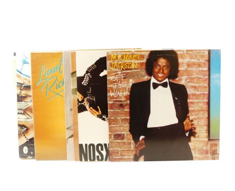 Twenty six vinyl LPs, mainly male solo artists, to include Paul Young - No Parlaz, Madness - Keep Moving, Johnny Cash - I For