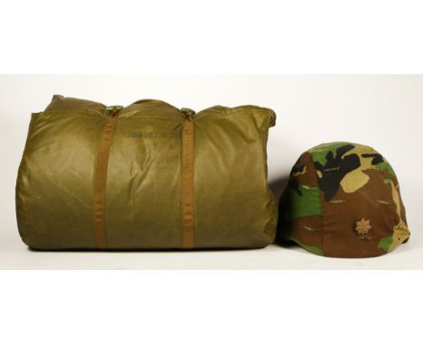 A British Army sleeping bag, manufactured by Chelsea Quilt Co Ltd, serial number J1/8405-99-120-8198, stamped with broad arro
