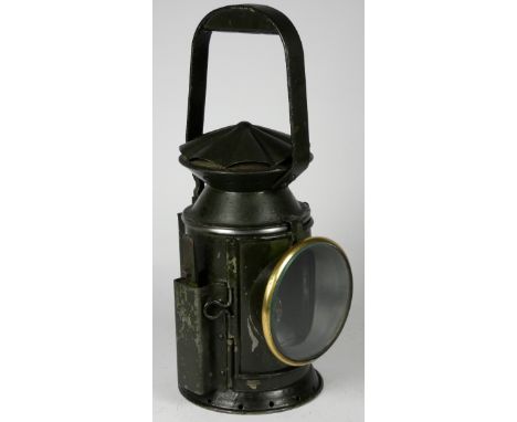 A green War Dept 3 aspect handlamp, marked with W.D. broad arrow 1944, complete with burner