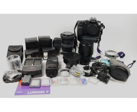 A Canon D30 DSLR camera, together with a a Sigma 28mm-135mm f3.8-f5.6 lens, a Sigma 70mm-300mm f4-f5.6 lens, a Canon TC-DC58A