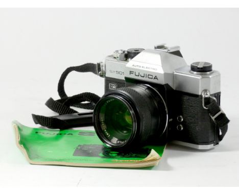 A Fujica ST901 35mm film camera, together with a Fujinon 55mm f1.8 lens, with lens capp, strap and manual 