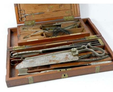 A set of Down Bros, London surgeons amputation tools, including saw, knifes, clippers, pinchers and other, in a wooden case w