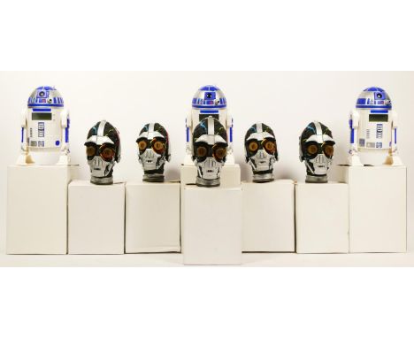 Three R2-D2 alarm clocks, boxed with instructions, together with five C3PO electronic heads, boxed, R2-D2 and C3PO toys givin