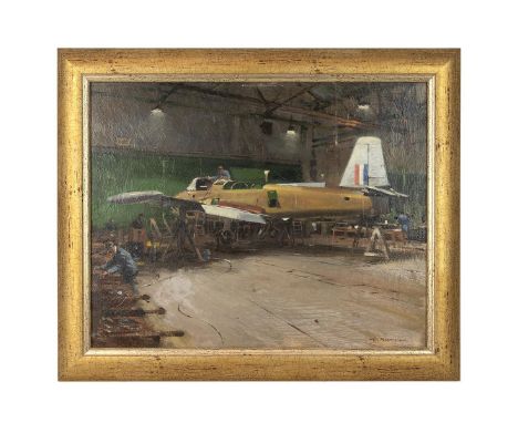 W Brown circa 1950 mechanics tending a military aircraft, a Hunting Percival Jet Provost, with tricolour to tail fin, in a ha