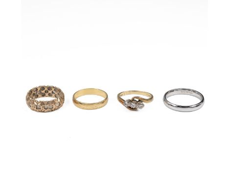 An 18ct white gold band size P an 18ct gold three stone diamond ring size J, 18ct gold band size L and a 9ct gold ring size K
