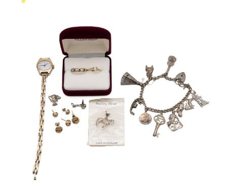 An assortment of jewellery including a 9ct gold ring, 10ct gold ring, two pairs of 9ct gold earrings a 9ct gold spring watch 