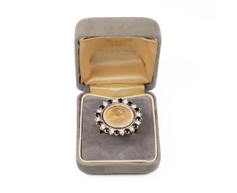 A 1/10th fine gold Krugerrand ring with paste and faux diamond and sapphire border mounted in 9ct gold total weight 8.8 grams