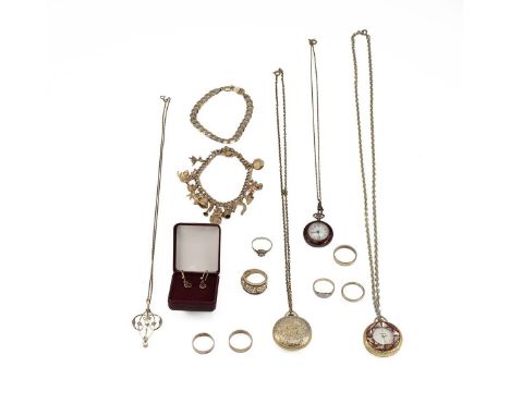An assortment of 9ct gold jewellery to include a charm bracelet with 17 charms, rings, an Art Nouveau aqua marine pendant etc