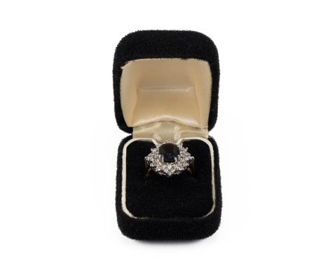 9ct gold. star burst faux diamond and sapphire cluster ring weight 4.9g, size O
