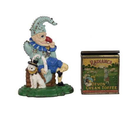 Mr Punch cast iron door stop, later paint; also a vintage Radiance Devon Cream Toffee tin. (2)