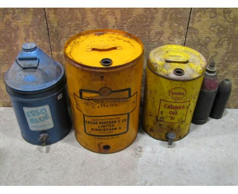 20th century automobila to include a vintage Esso blue paraffin container with brass tap, two cylindrical oil drums, four ena