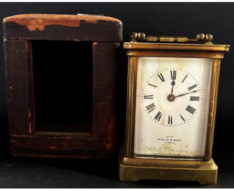 Brass carriage clock with bespoke travel case, the clock with eight day time piece 
