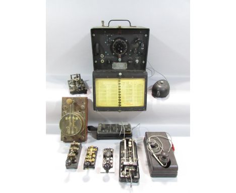 A collection of Morse Code Telegraphs, including a WWII example, together with an U.S Army Signal Corps Frequency Bendix Radi