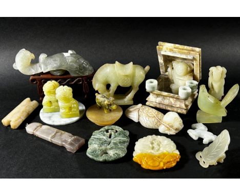 A mixed collection of Chinese bowenite / jadeite jade items to include a pale grey belt hook, Bi disks, carved figures, a sma