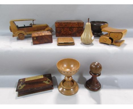 Mixed treen to include a burr walnut box, a vintage model car, a bowling ball, a pear, a chalice, etc 