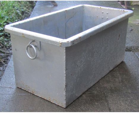 A painted rectangular fabricated steel trough with ring handles, 31cm high x 67cm long x 36cm wide 