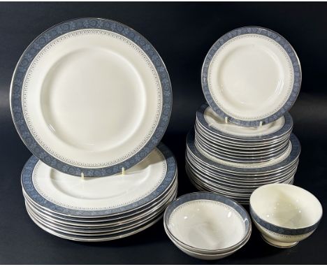 A Royal Doulton Sherbrooke dinner service comprising plates, bowls, cream jug and sugar basin 