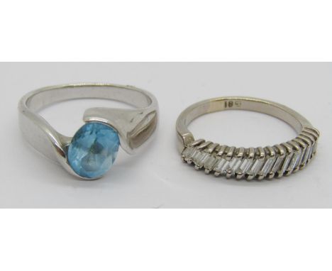 18ct white gold baguette-cut diamond half hoop ring, size P, 4.1g and a silver crossover ring set with a blue stone (2)
