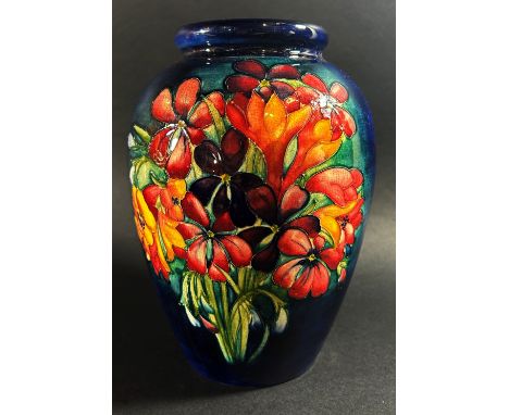 A Moorcroft floral porcelain vase, signed to underside 