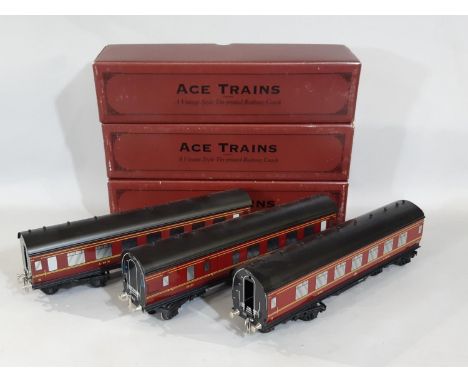 3 boxed 0 gauge LMS tin-plate coaches by Ace Trains comprising a 1st/3rd, a 3rd and 3rd/Brake Coach all in lined LMS maroon l