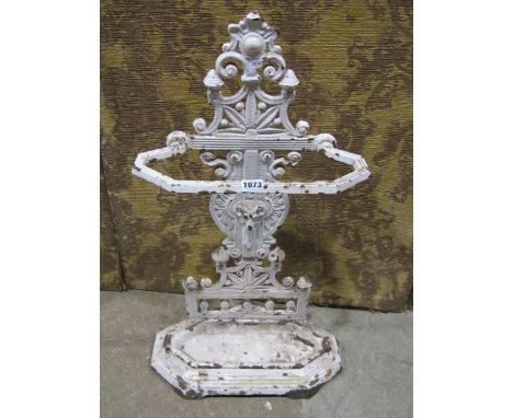A Victorian iron stick stand with rams mask and geometric detail with drip tray and lozenge mark 