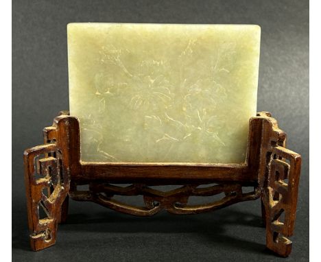 A Chinese pale jade / hardstone screen panel, carved in shallow relief to one side with blossoming chrysanthemum, 6 x 8cm, ra