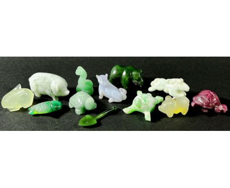 A small collection of Chinese carved hardstone, jadeite and quartz figures to include a cat eating a carp, 6cm long, a red ag