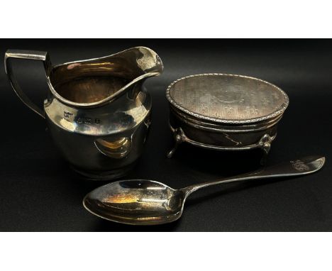 A small silver milk jug, an oval silver trinket box and a cased single christening teaspoon, 4.2oz approx (3) 