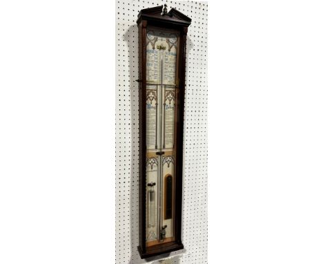An Admiral Fitzroy barometer, the printed back with Gothic tracery outline, set within a mahogany case 