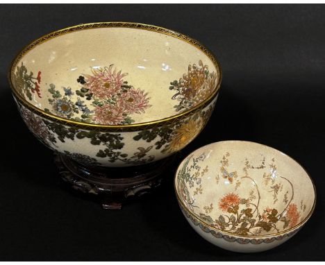A 19th century Japanese Satsuma porcelain bowl, decorated with chrysanthemum and other blossoms, signed and labelled to under