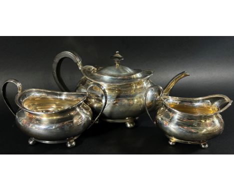 A three piece silver tea service, Sheffield 1925 and an earlier sugar bowl, 1915, both made by Atkin Brothers, 37oz approx 