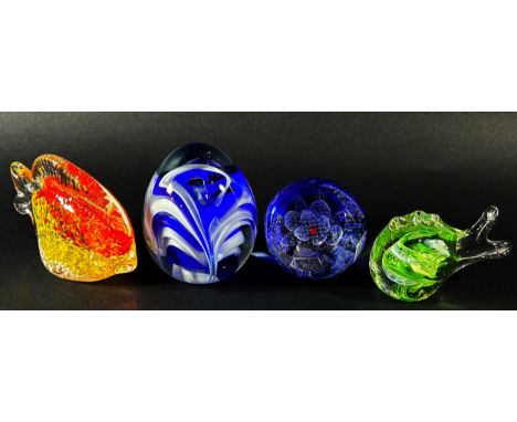 A collection of glass paperweights to include a Caithness ‘Fae Pink’ example with box, two exotic fish, a millefiori type exa