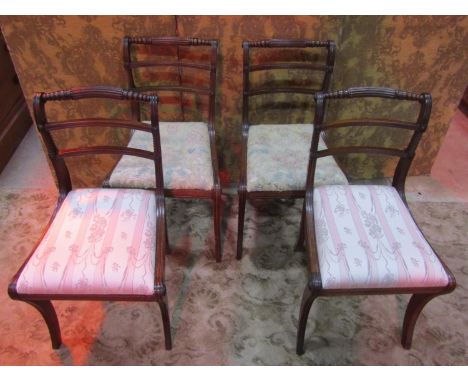 A set of four Regency mahogany bar back dining chairs with reeded frames, drop-in seats and sabre supports, together with a C