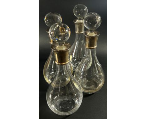 Two Millennium silver collared decanters Sheffield 2000 and two matching decanters dated Sheffield 2010 all made by Carr’s of