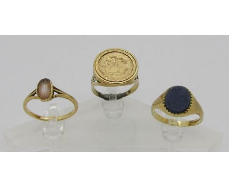 Three 9ct rings; a signet ring set with lapis lazuli, 2.8g, a gem set example, 2.4g and an example set with an 'Estados Unido