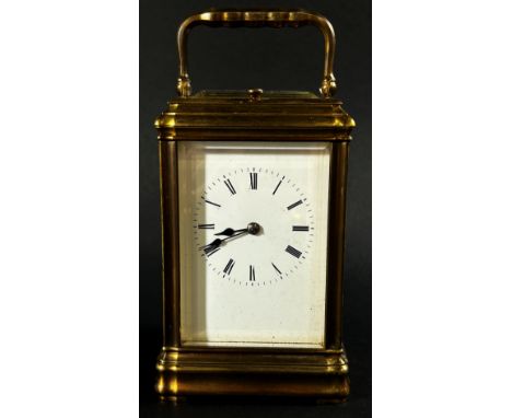 A 19th century brass carriage clock with enamelled dial, with eight day striking movement, currently running 