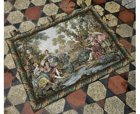 A 18th century French style tapestry, of two Gentlemen entertaining a group of young ladies by a stream , one with his rod ou