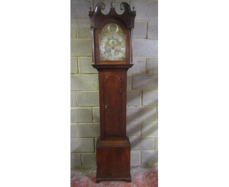 A Georgian oak longcase clock, the hood with reeded column supports set beneath a swan neck pediment enclosing a broken arch 