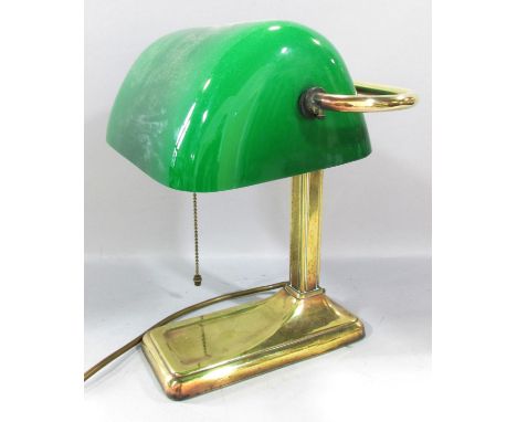 A Brass bankers lamp with a swivel green glass shade. 28cm high. 