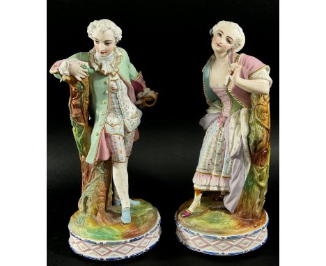 Two pairs of continental porcelain figures, one with hand painted detail showing male and female characters in 18th century d
