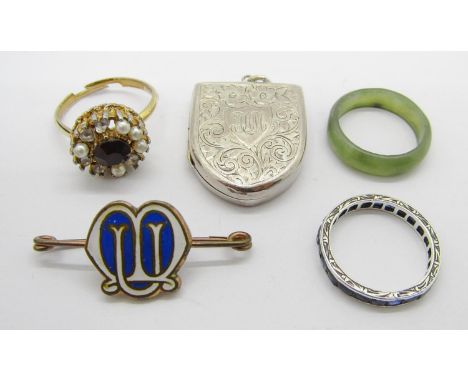 Mixed lot of jewellery to include a white metal calibre-cut sapphire eternity ring, an antique silver shield shaped locket, m