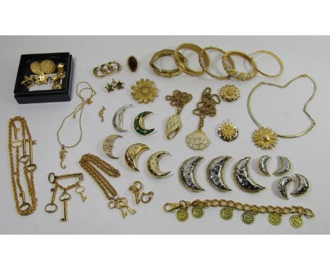 Collection of contemporary gilt costume jewellery, designs to include moons, stars, sunflowers, etc, three pairs of Monet ear