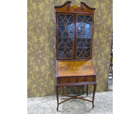 A good example of an inlaid Edwardian mahogany bureau bookcase in the Georgian style, the upper section enclosed by a pair of