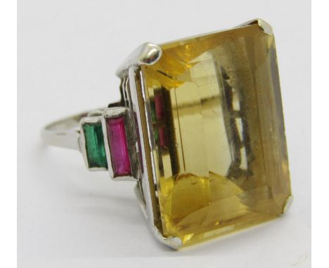 Art Deco style white metal multi gem cocktail ring, set with a large citrine flanked by stepped baguette-cut ruby and green g