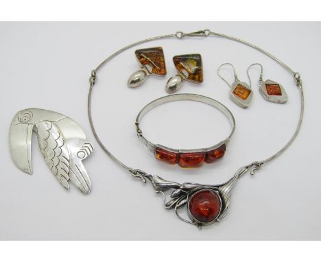 Danish silver toucan brooch, maker 'FA', 1993, together with a selection of stylised silver amber jewellery comprising a foli
